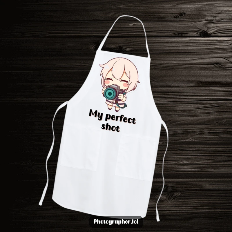 Funny apron with a winking character adjusting a camera strap, perfect for chefs and photographers who love humor.