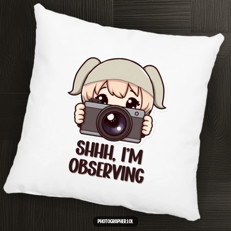 Funny pillow featuring a character peeking out from behind a camera with big eyes, a comfortable and humorous decor item for photographers.