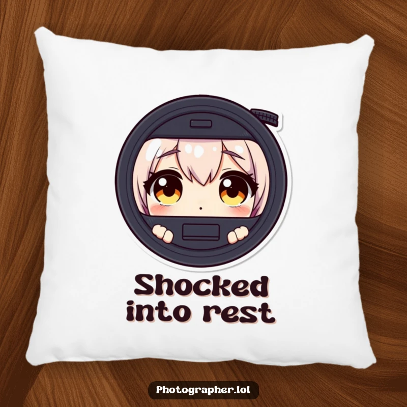 Funny pillow with a character's wide, surprised eyes looking through a camera viewfinder, adding humorous decor.