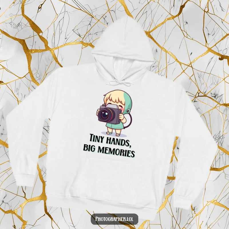 Funny hoodie with a tiny character gleefully photographing with a bulky, retro camera, ideal for cold days.