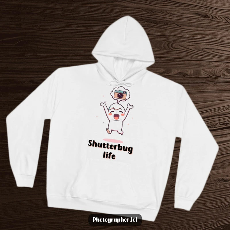 Funny Hoodie: An adorable character joyfully jumps, with a camera icon prominently featured in their thought bubble.
