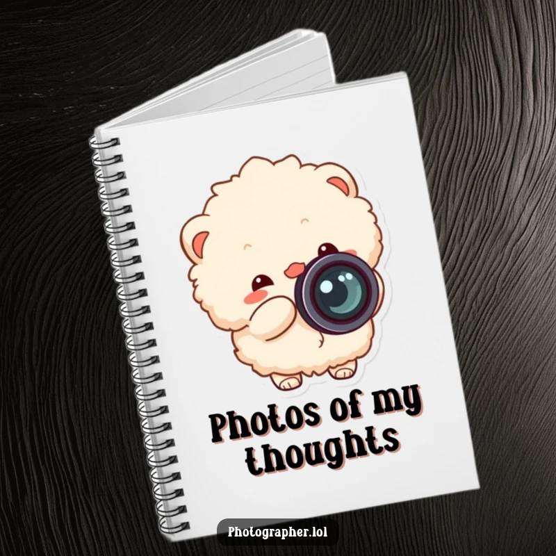 Funny fluffy photographer notebook, for capturing ideas with a cheerful character snapping a camera, lens cap flying off.